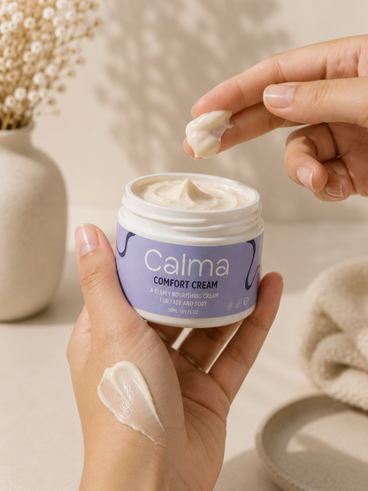 Person applying Calma Comfort Cream to their hand with a neutral background