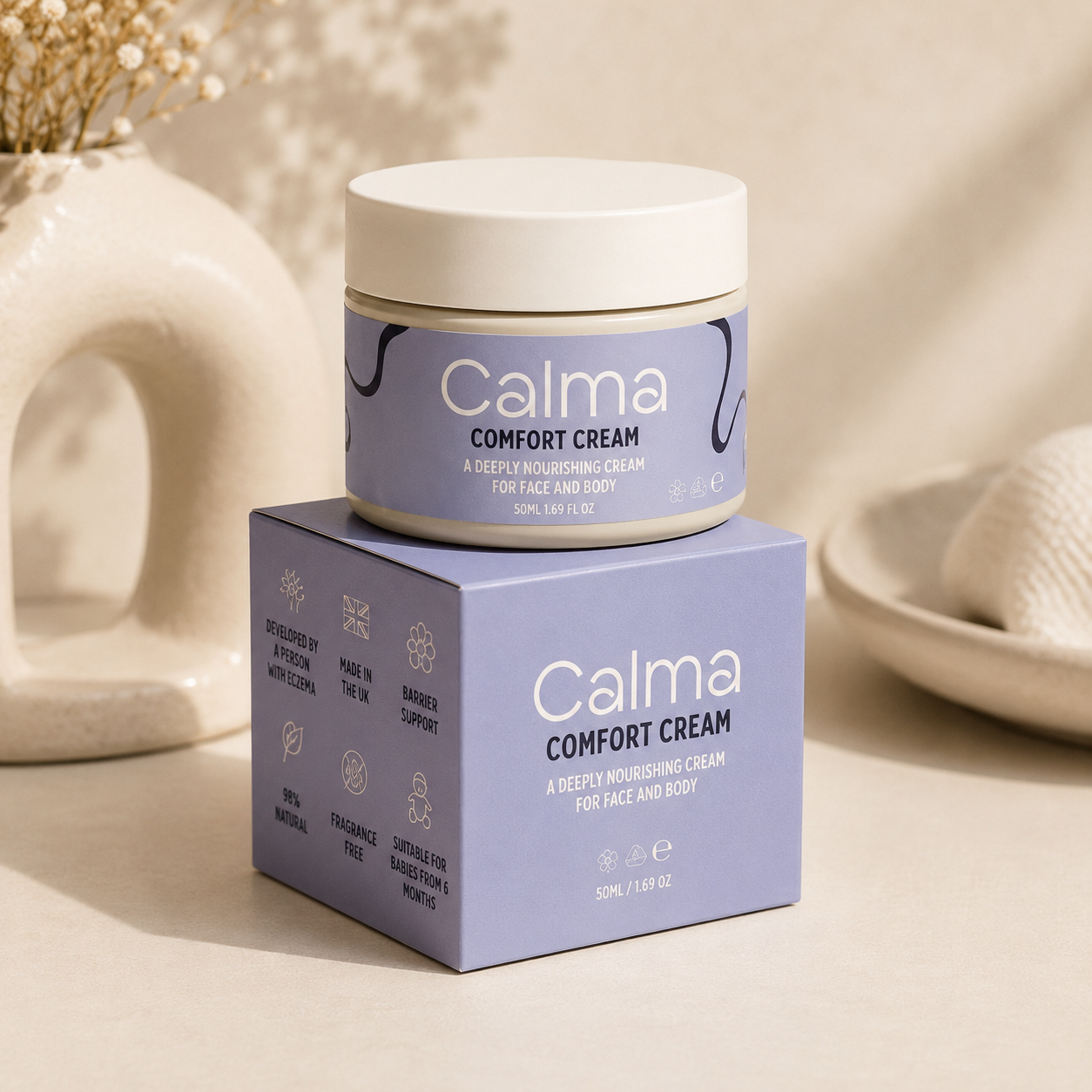 Calma Comfort Cream jar and box on a neutral background
